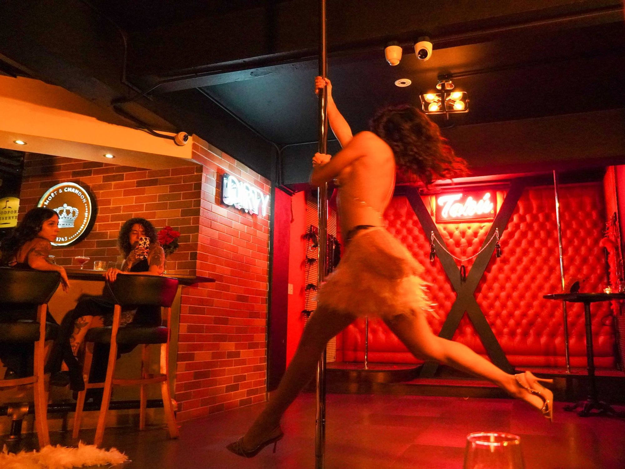 Naomi Curbelo dances in a strip club.