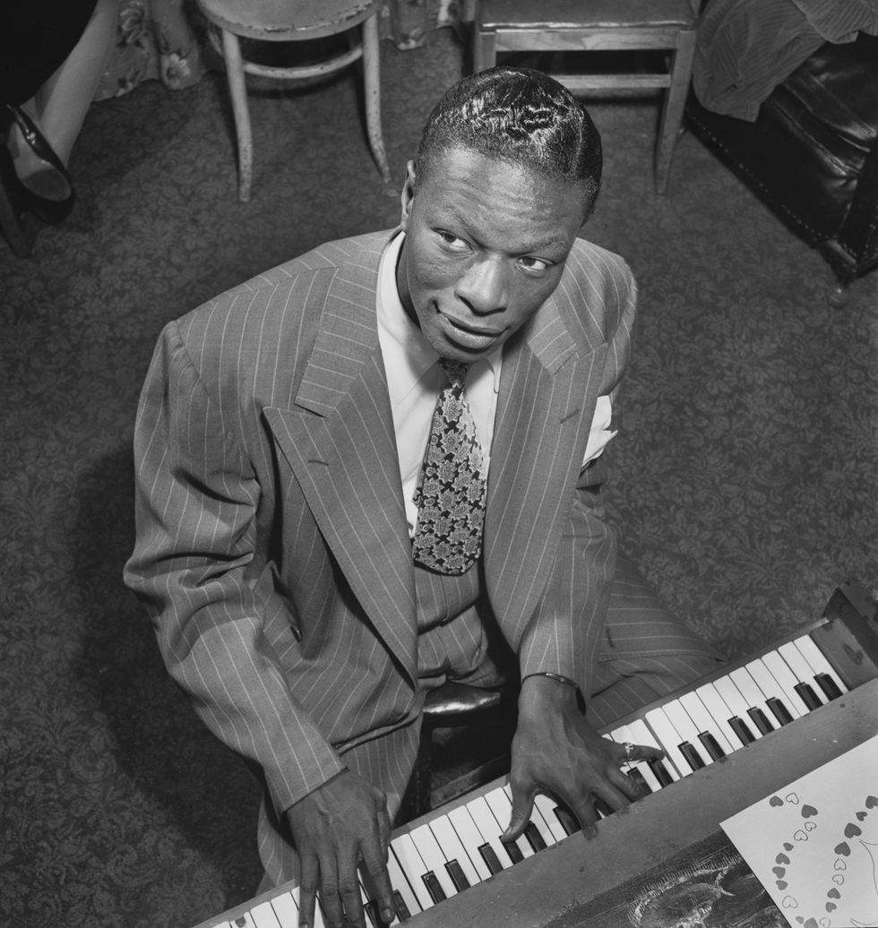 Nat King Cole playing the piano in New York City, 1947.