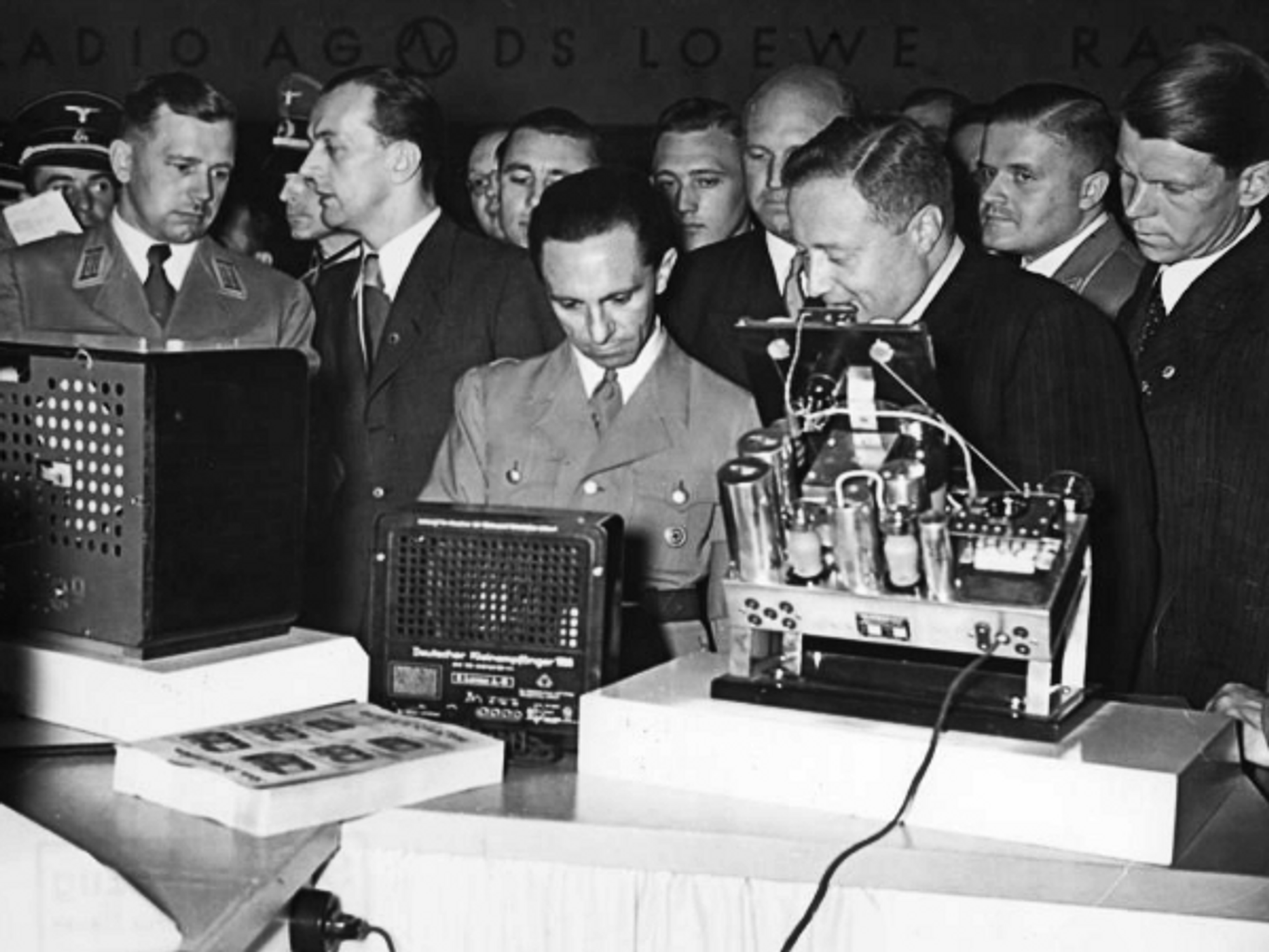 Nazi propaganda chief Joseph Goebbels (center) checking radio devices in 1938