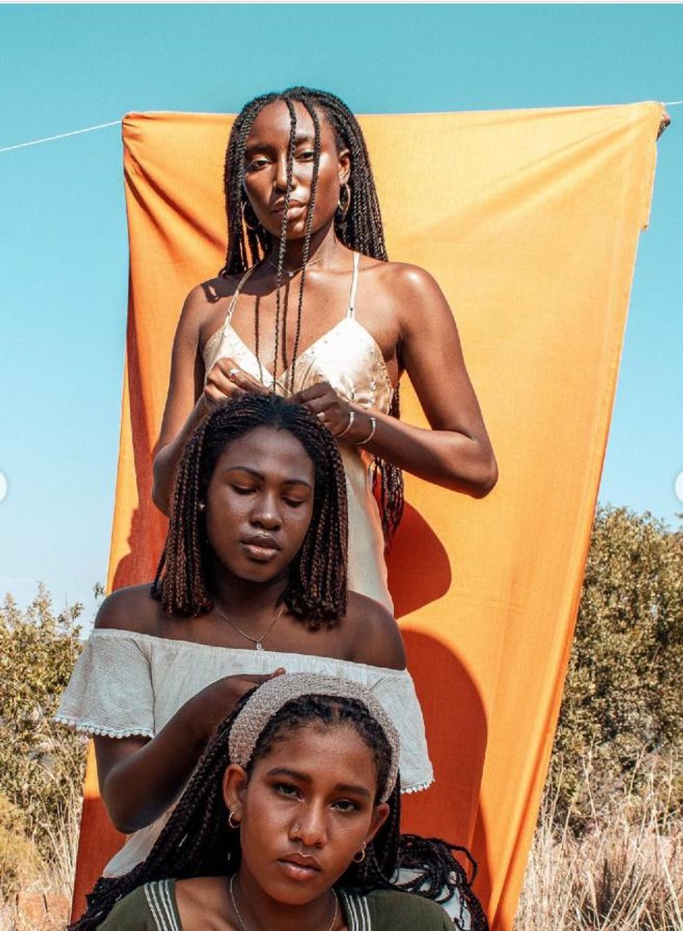 NGO afrofeminism activists pausing together in the framework of the realisation of a short film titled “BVUDZI” which roughly translates to hair in Shona, follows a young woman as she retells the story of her hair,