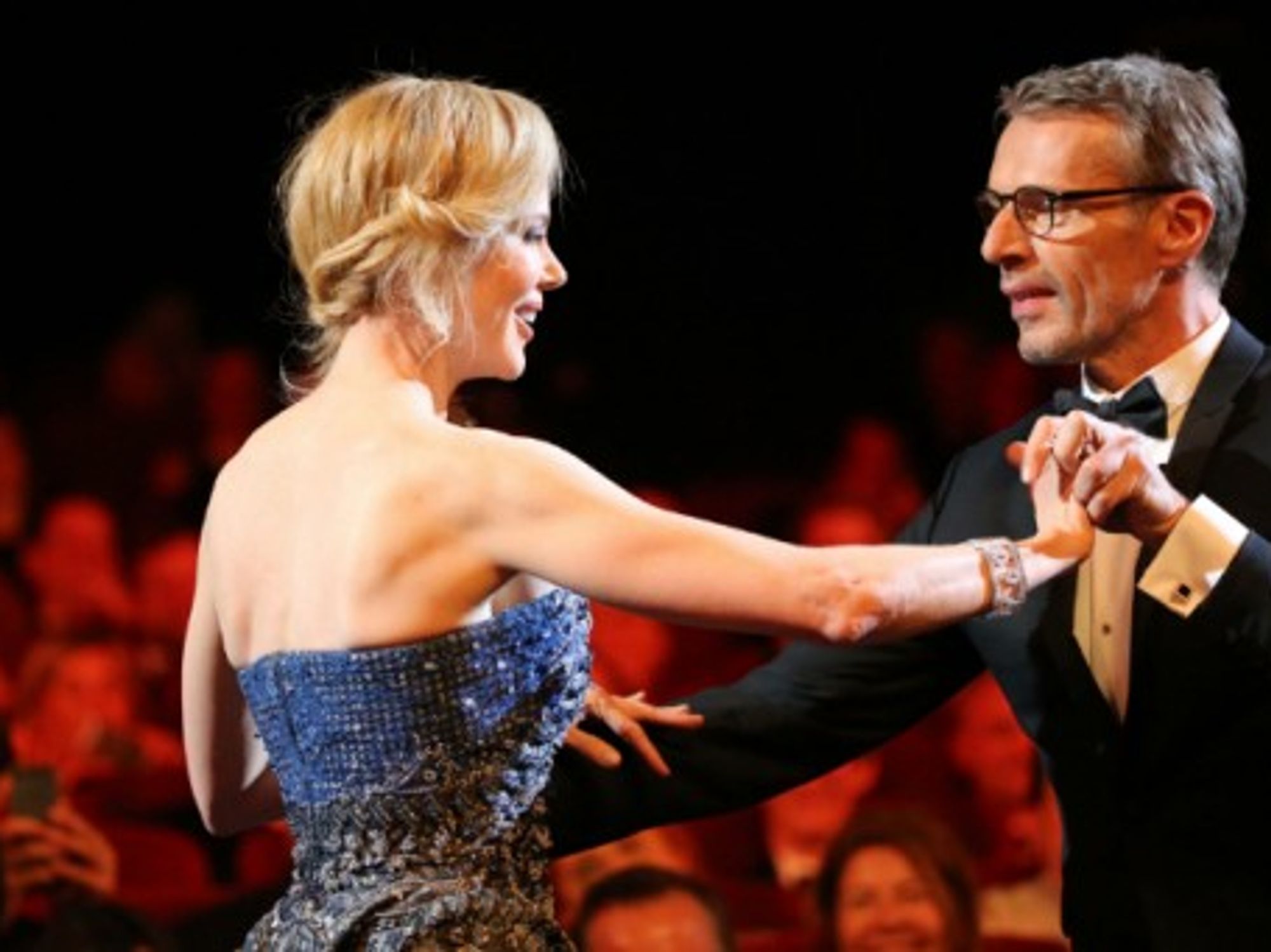 Nicole Kidman and Lambert Wilson dance briefly during the opening ceremony of the 67th Cannes International Film Festival