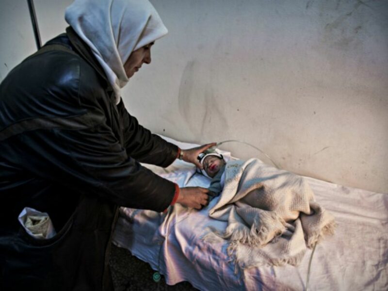 Nurse and baby at a hospital in Yabrud, Syria