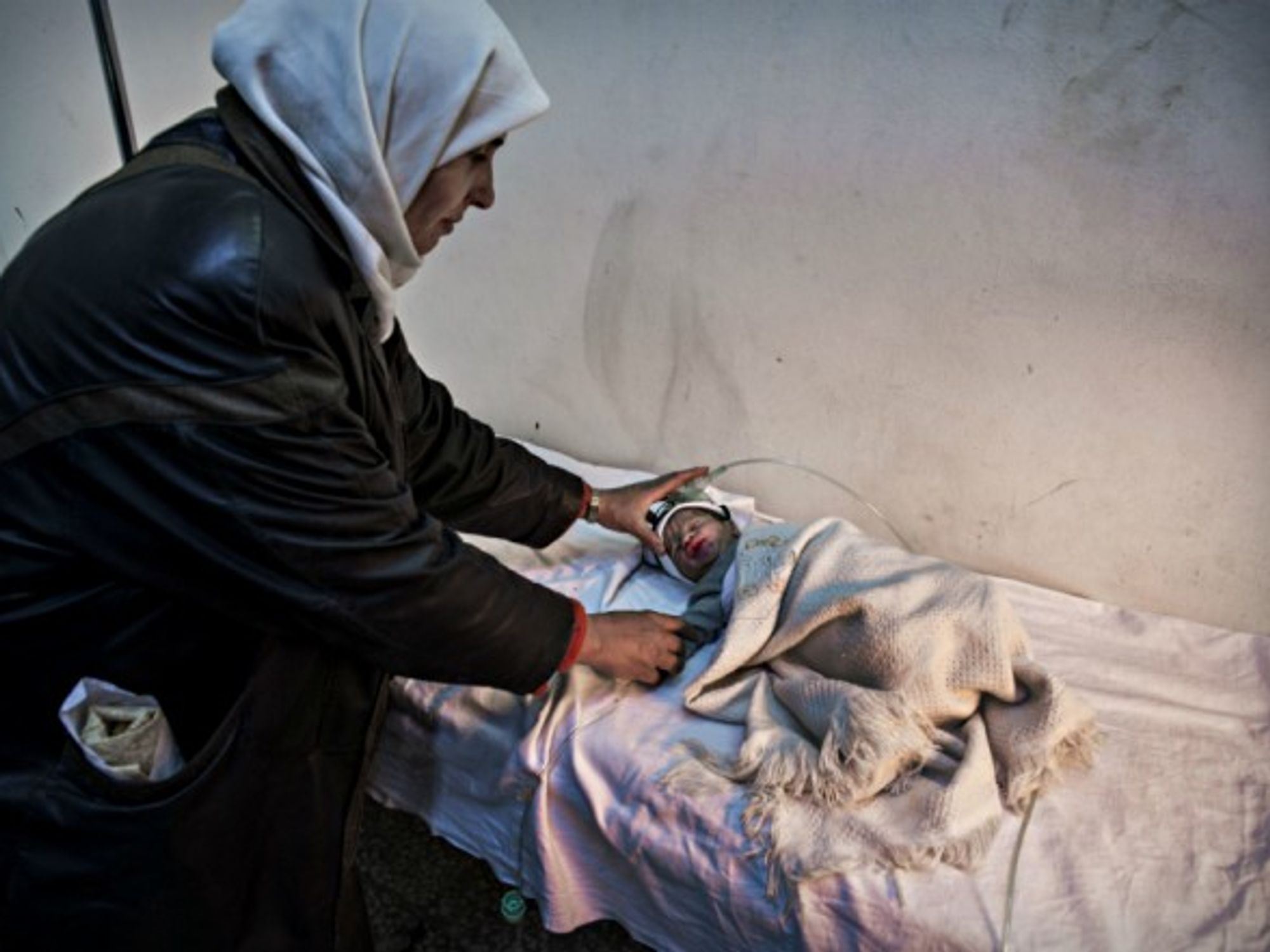 Nurse and baby at a hospital in Yabrud, Syria