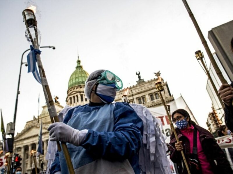 Nurses protesting in front of the Argentinian Congress during yesterday’s International Nurses’ Day. The pandemic continues to hit Argentina hard, with 24,475 new cases and 496 deaths reported on Tuesday.