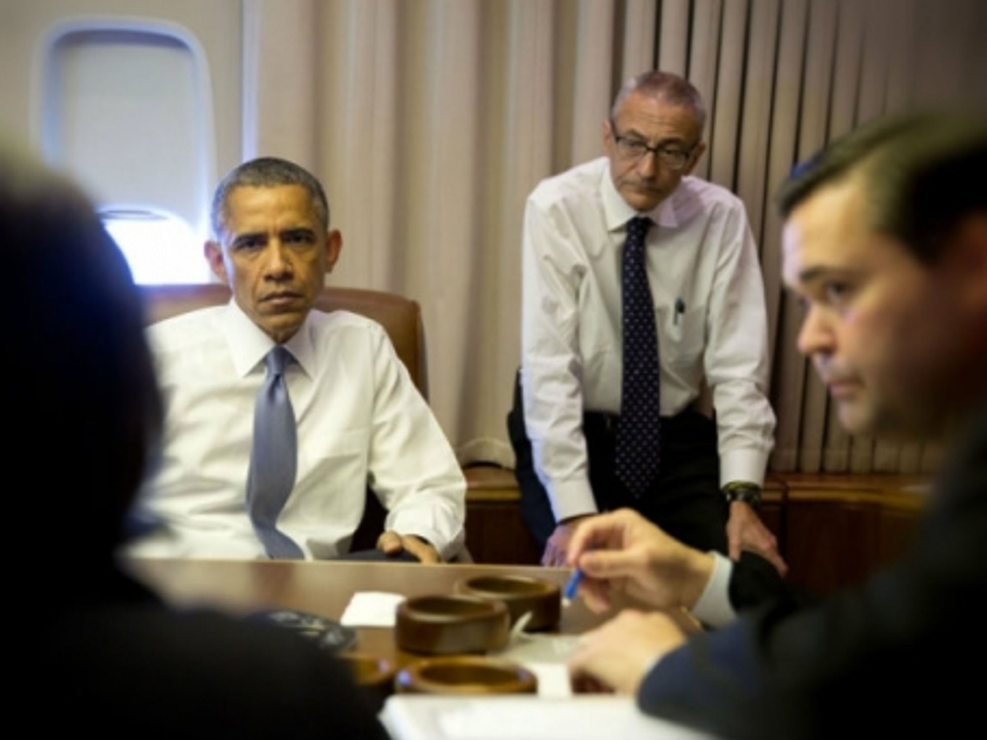 Obama and top advisors on Air Force One.