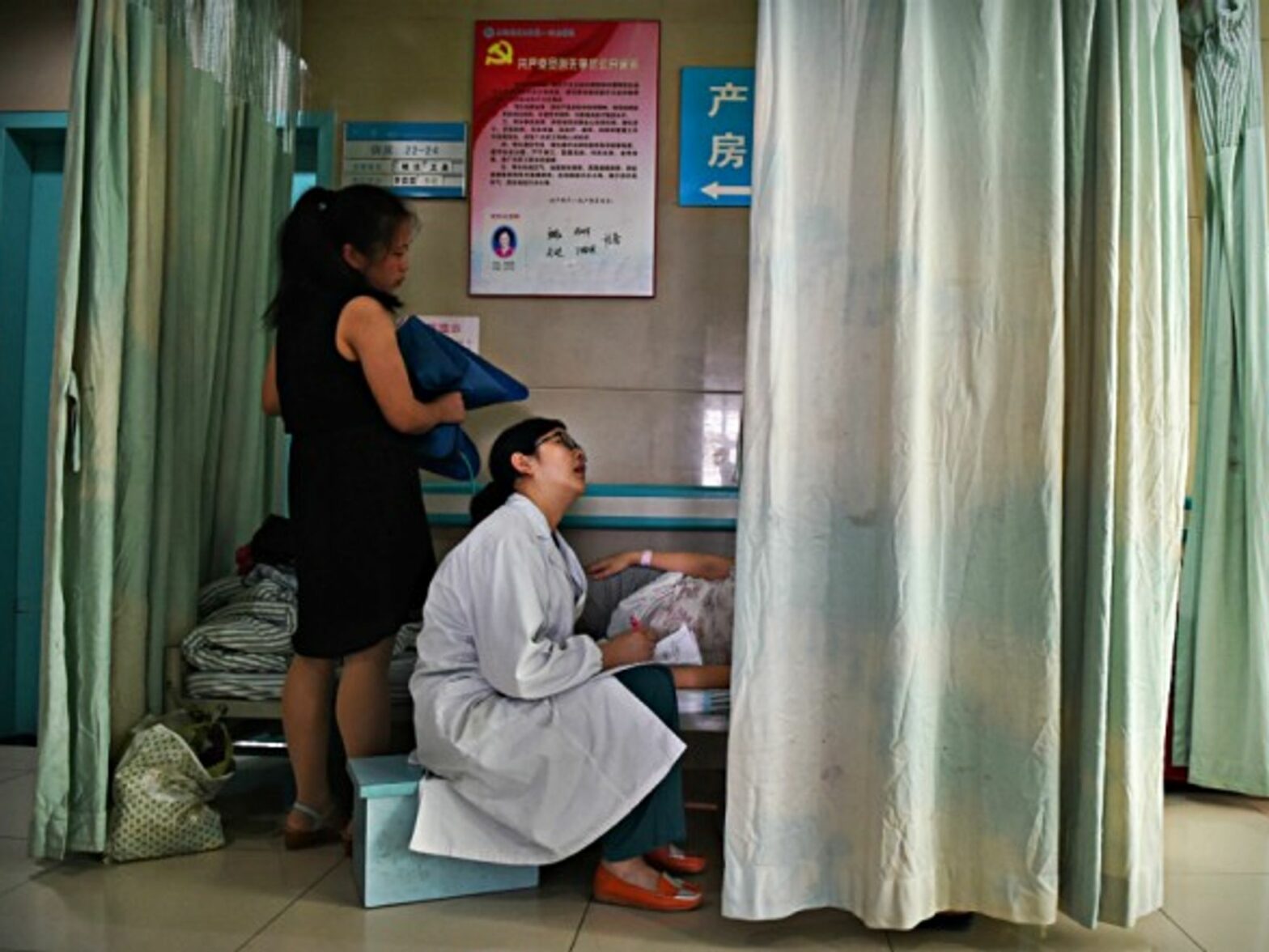 Obstetrician inspects a pregnant woman in Hefei, China