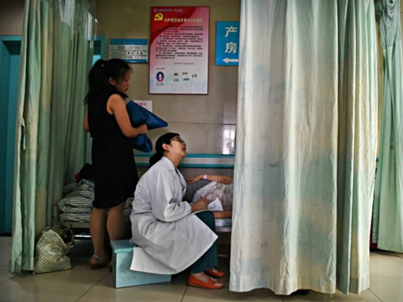 Obstetrician inspects a pregnant woman in Hefei, China