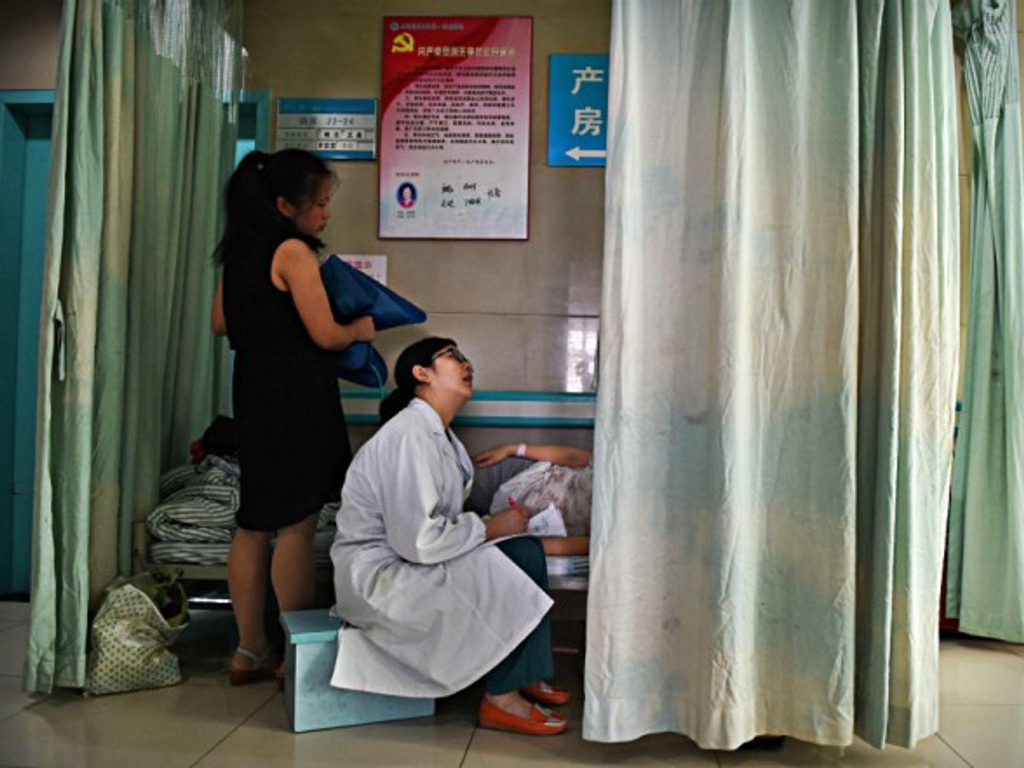 Obstetrician inspects a pregnant woman in Hefei, China