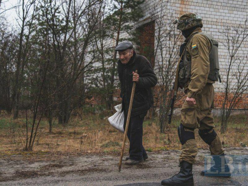 Old man and a Ukrainian soldier.