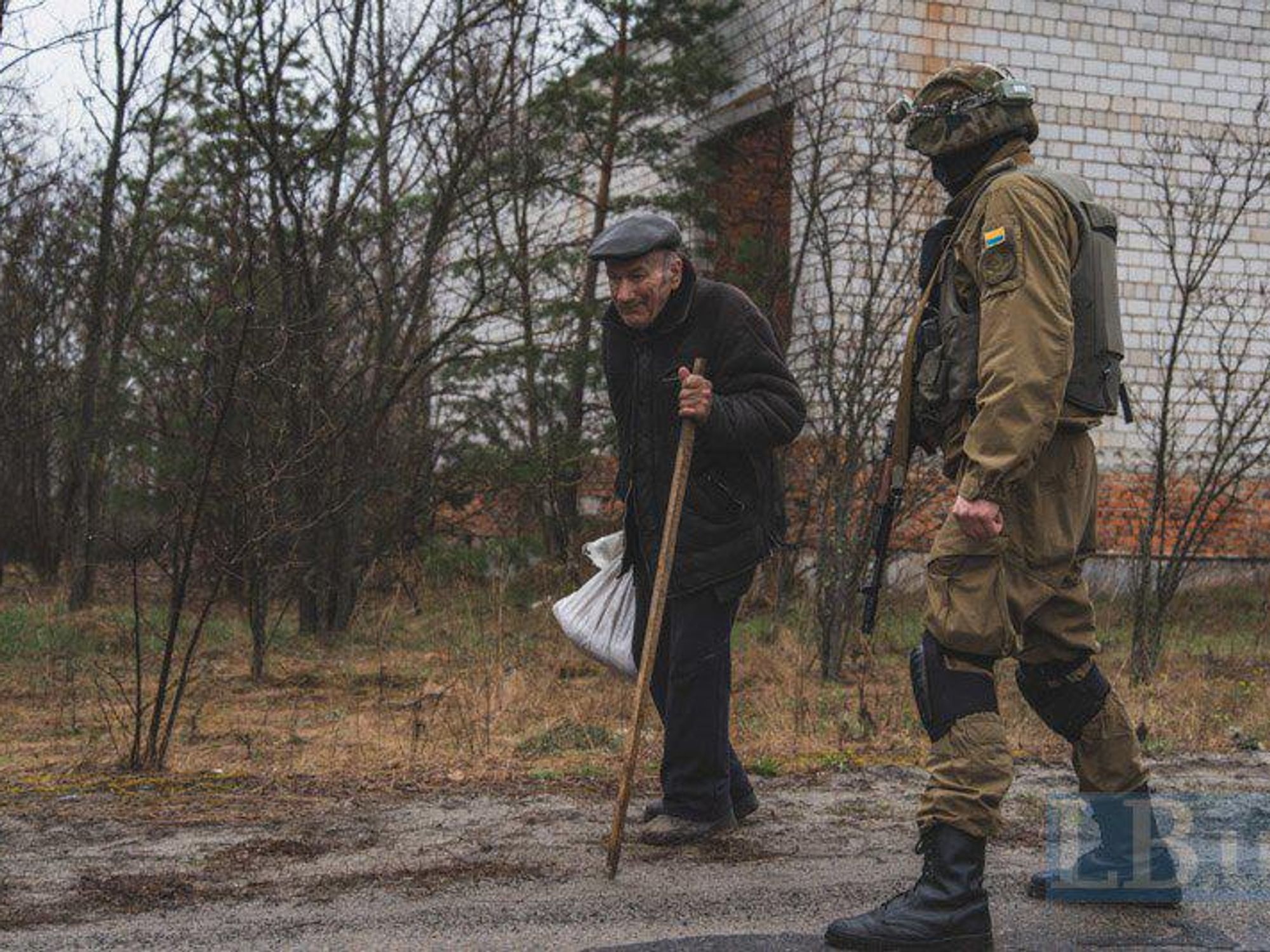 Old man and a Ukrainian soldier.