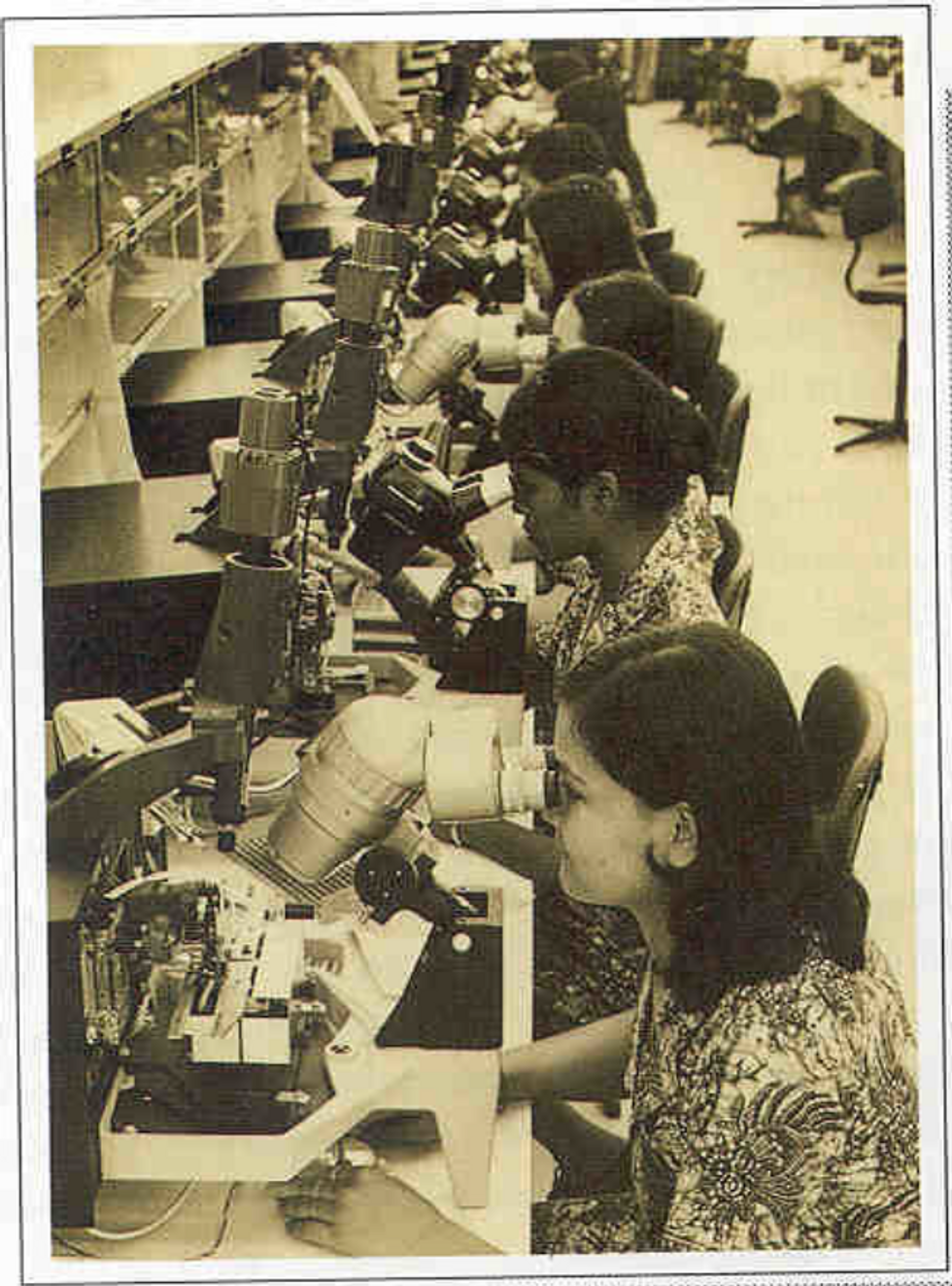 old photo of a factory with workers
