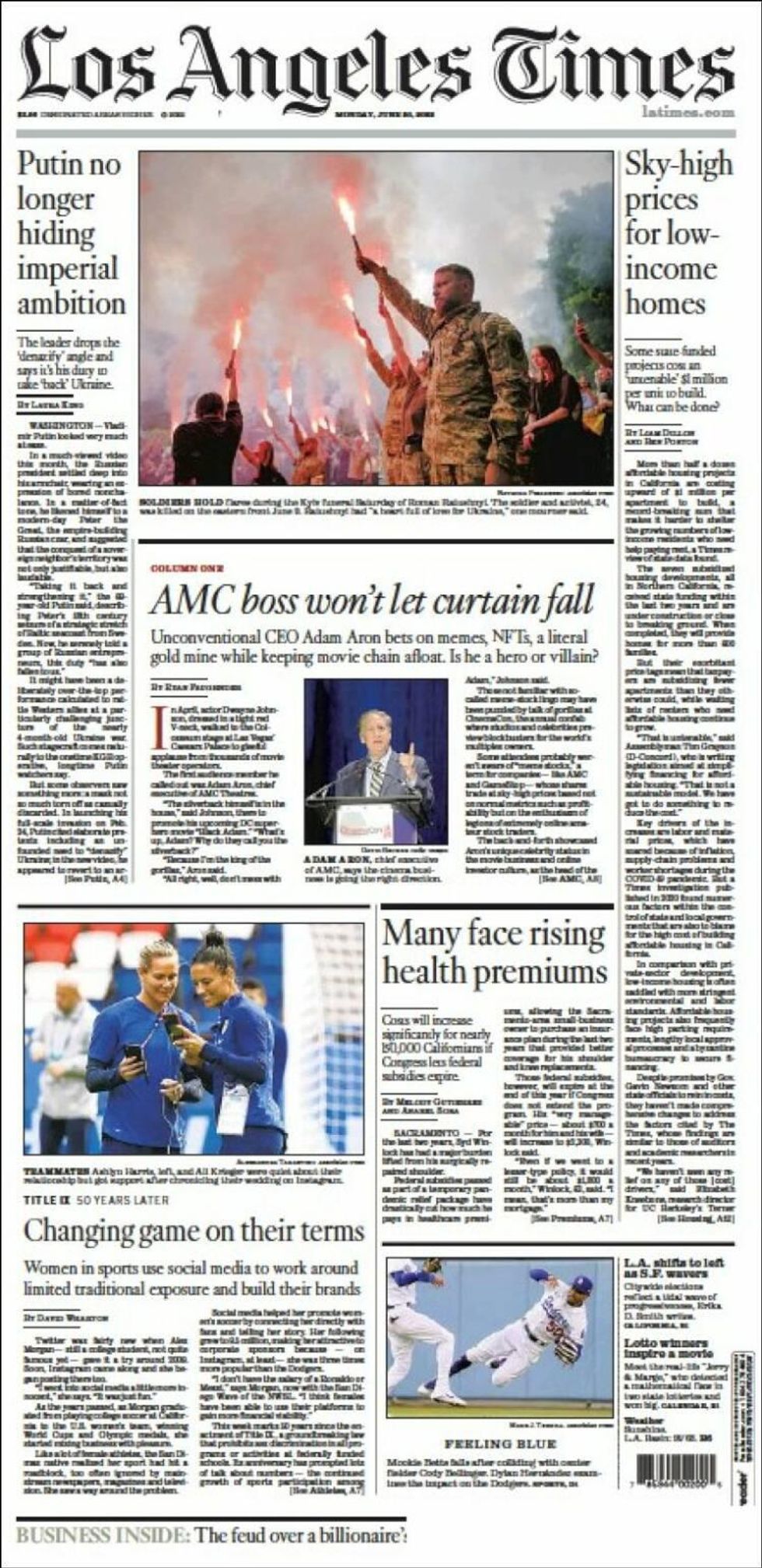 On Los Angeles Times front page, mourners and soldiers hold flares in honor of Ukrainian activist and soldier Roman Ratushnyi