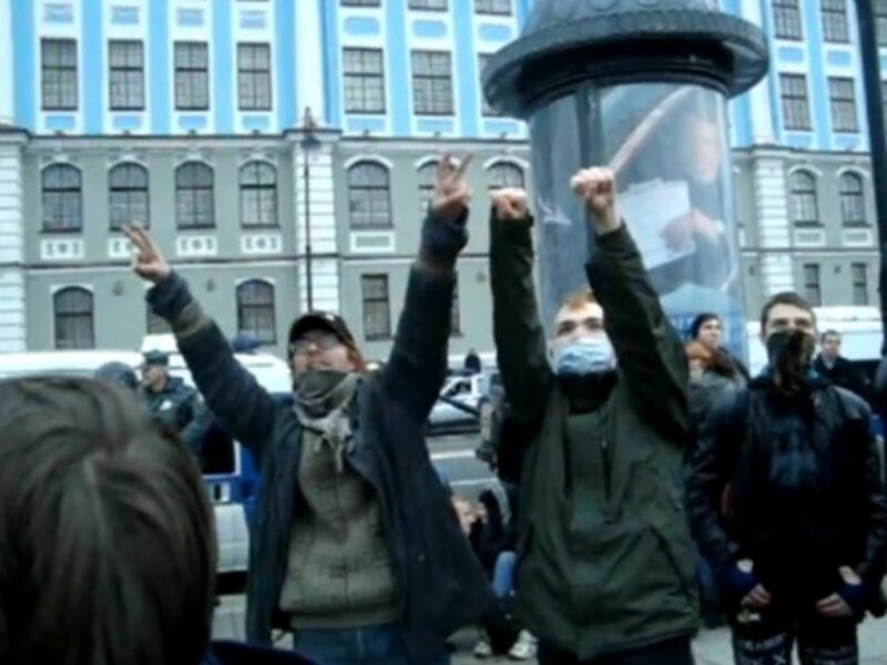Onlookers cheer the protesting