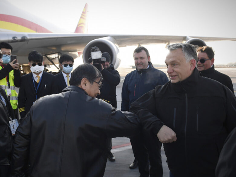 Orban greets a Chinese crew with elbow-bumps after arrival of supplies to fight COVID-19 arrived in Budapest