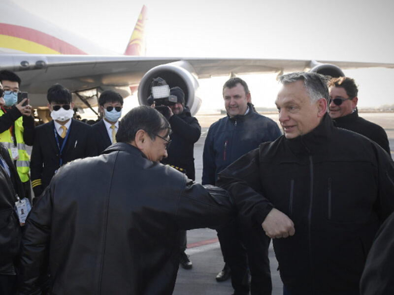 Orban greets a Chinese crew with elbow-bumps after arrival of supplies to fight COVID-19 arrived in Budapest