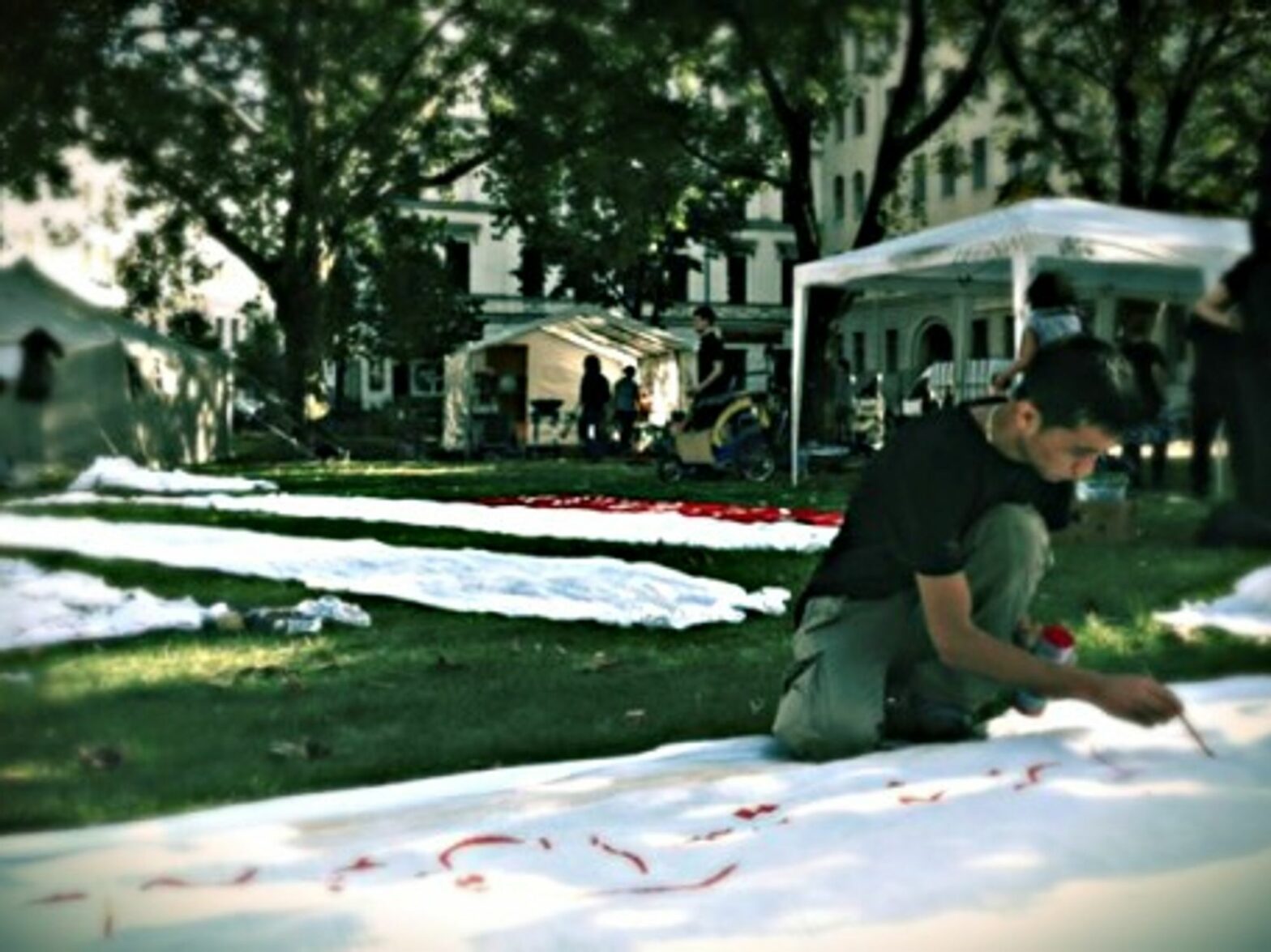 Painting banners in Berlin's Oranienplatz square