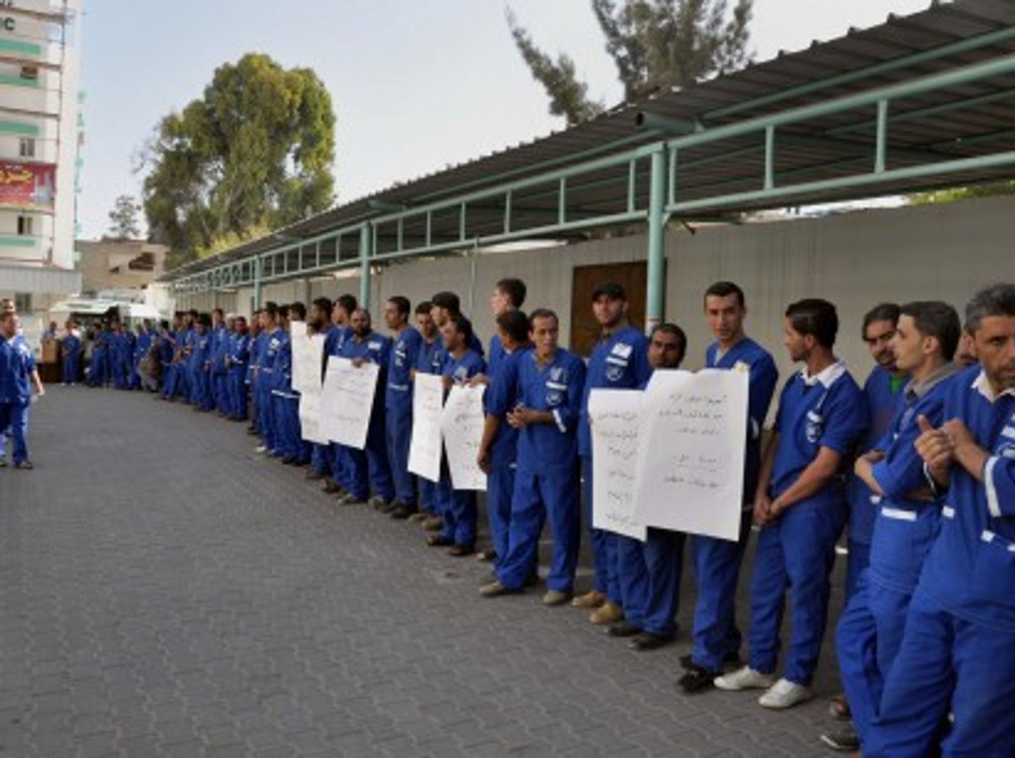 Palestinian cleaners protest to demand their salaries in Gaza City.