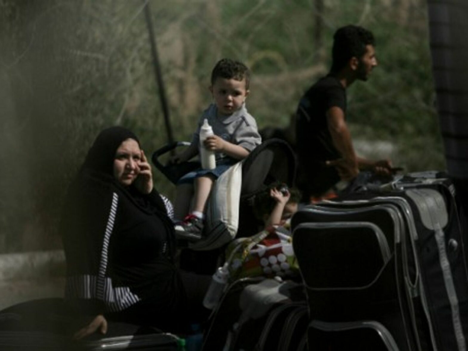 Palestinian Family At Rafah Border Crossing