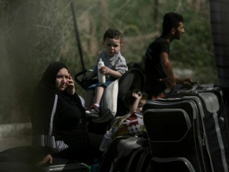 Palestinian Family At Rafah Border Crossing