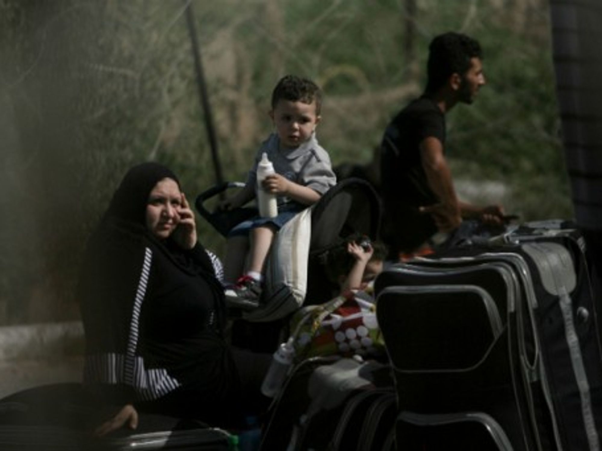 Palestinian Family At Rafah Border Crossing