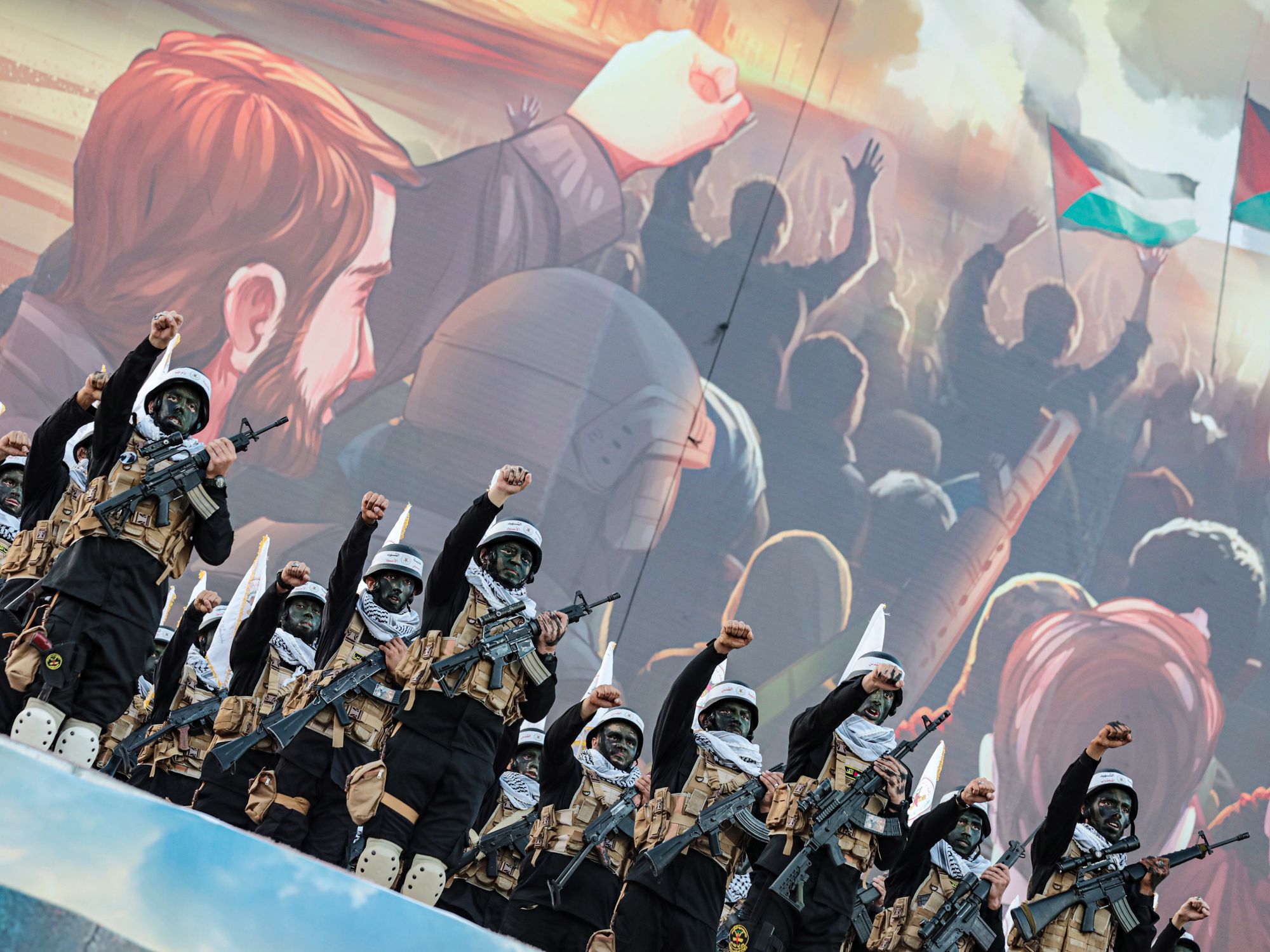 Palestinian fighters from Al-Quds Brigades, the military arm of the Islamic Jihad movement, participate in the 36th festival for the launch of the movement