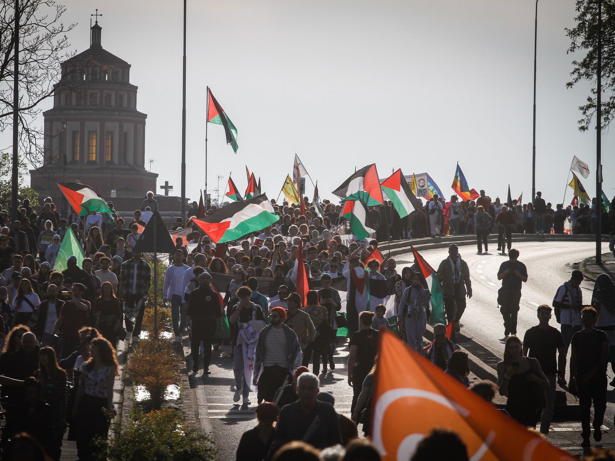 Palestinian flags Saturday at a protest in Milan's Piazza Tricolore.