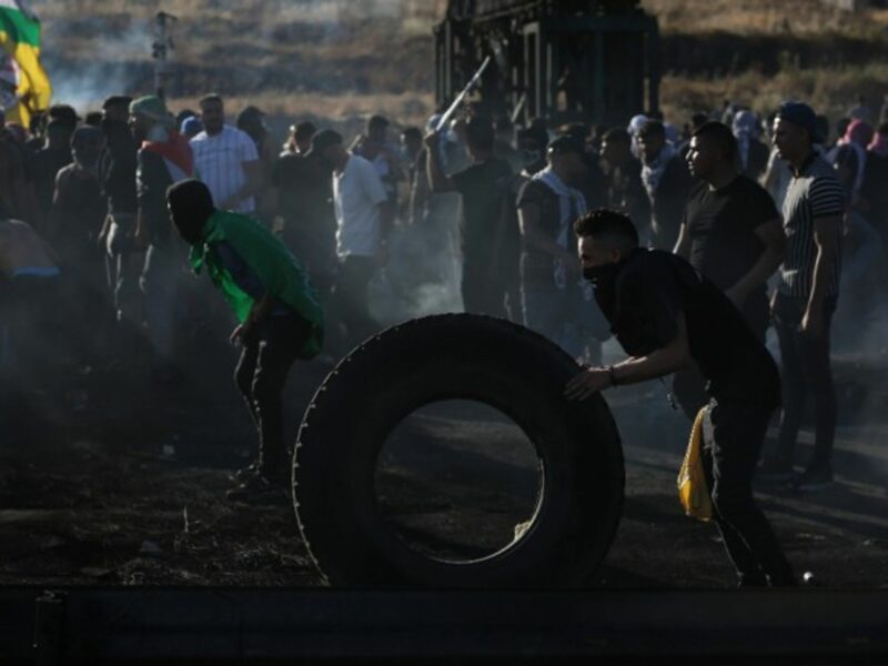 Palestinian protesters clash with Israeli soldiers near Nablus in the occupied West Bank