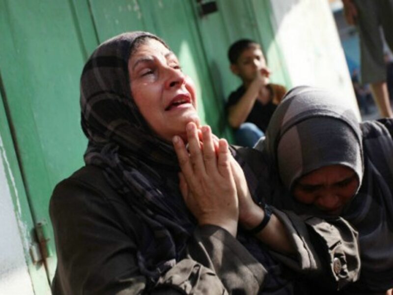 Palestinian relatives of victims after Israeli air strikes hit a refugee camp in Gaza