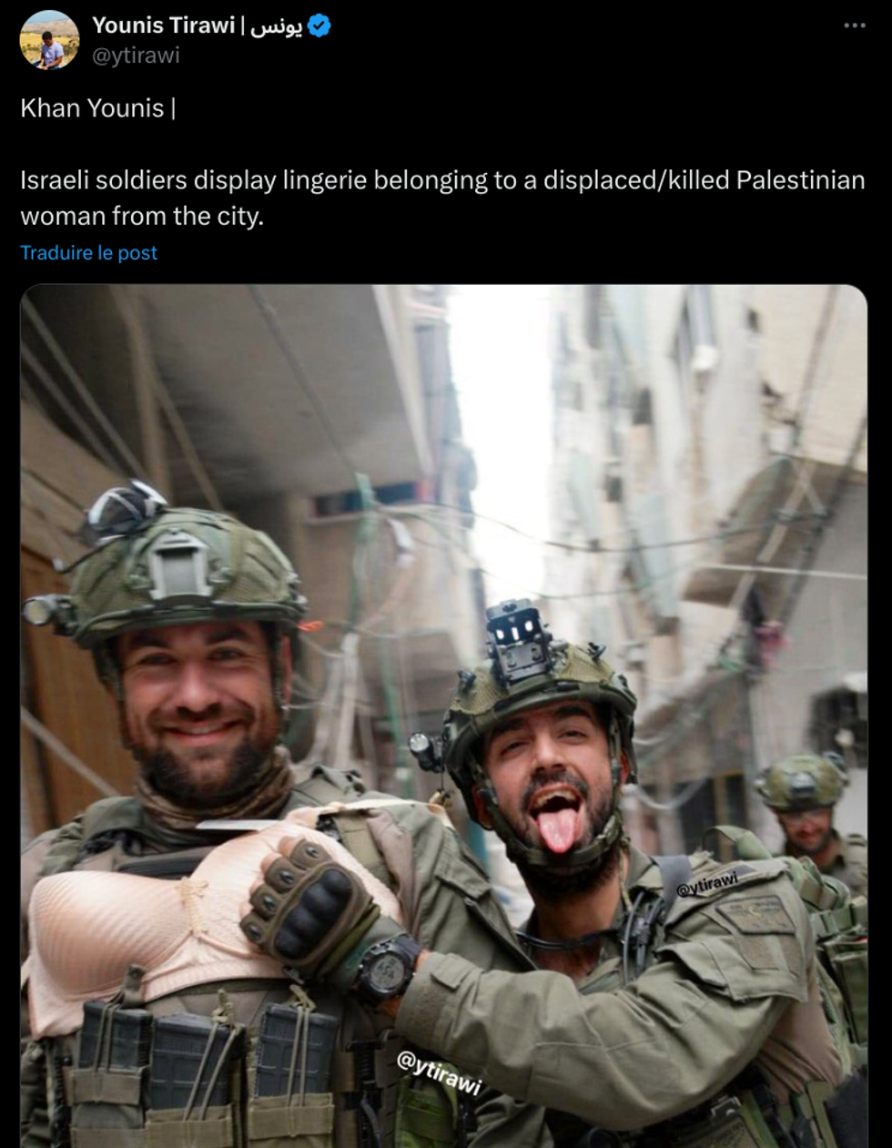 Palestinian reporter Younis Tirawi shares a picture of Israeli soldiers posing with the underwear of a Palestinian woman.