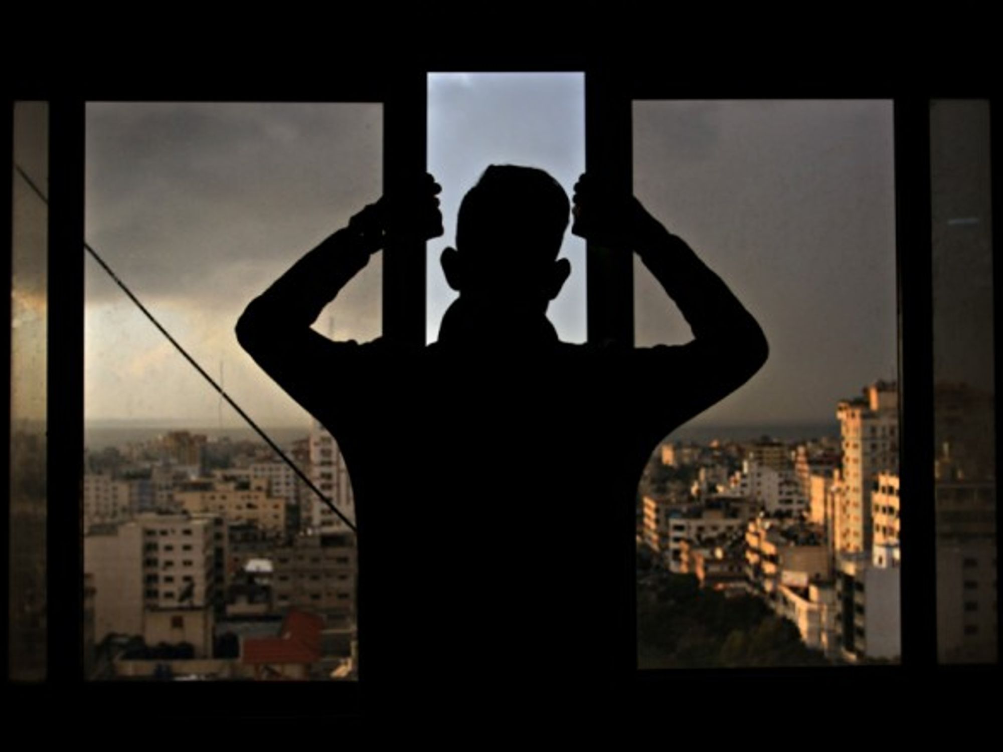 Palestinian youth looking over Gaza City