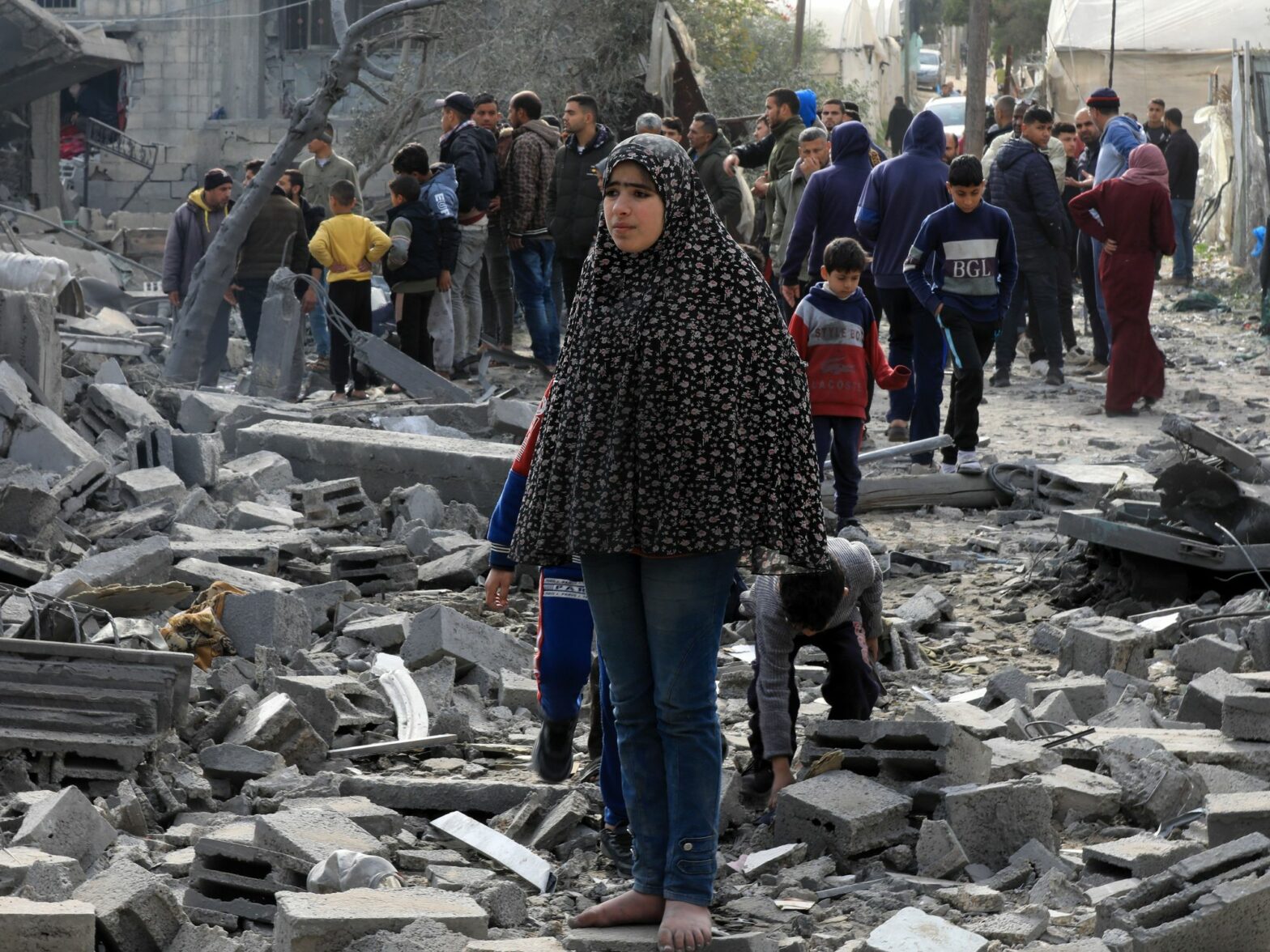 Palestinians check the rubble of buildings damaged by Israeli airstrikes in the southern Gaza Strip city of Rafah.​