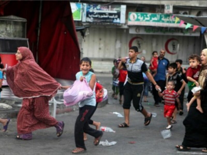 Palestinians flee the Shujayeh neighborhood during heavy Israeli shelling in Gaza City.