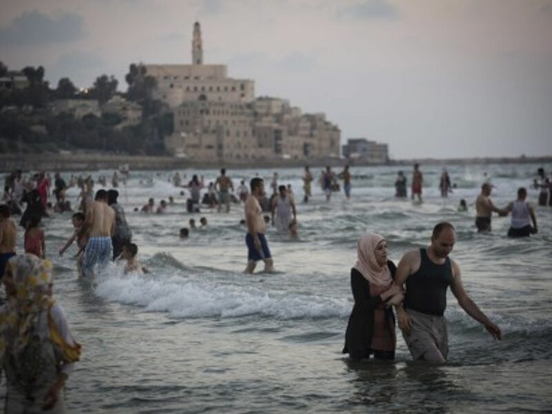 Palestinians from the West Bank enjoy the Mediterranean Sea during Ramadan, Tel Aviv, Aug. 11, 2013.