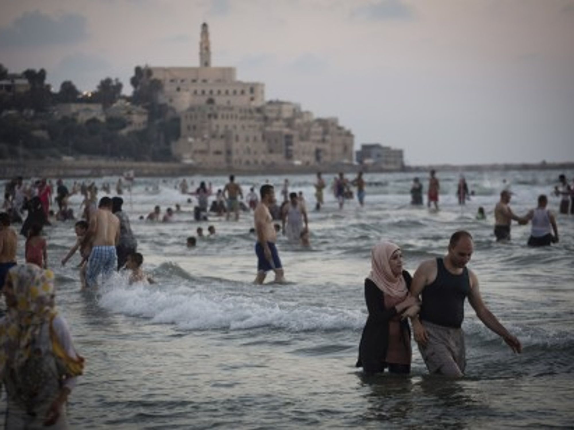 Palestinians from the West Bank enjoy the Mediterranean Sea during Ramadan, Tel Aviv, Aug. 11, 2013.