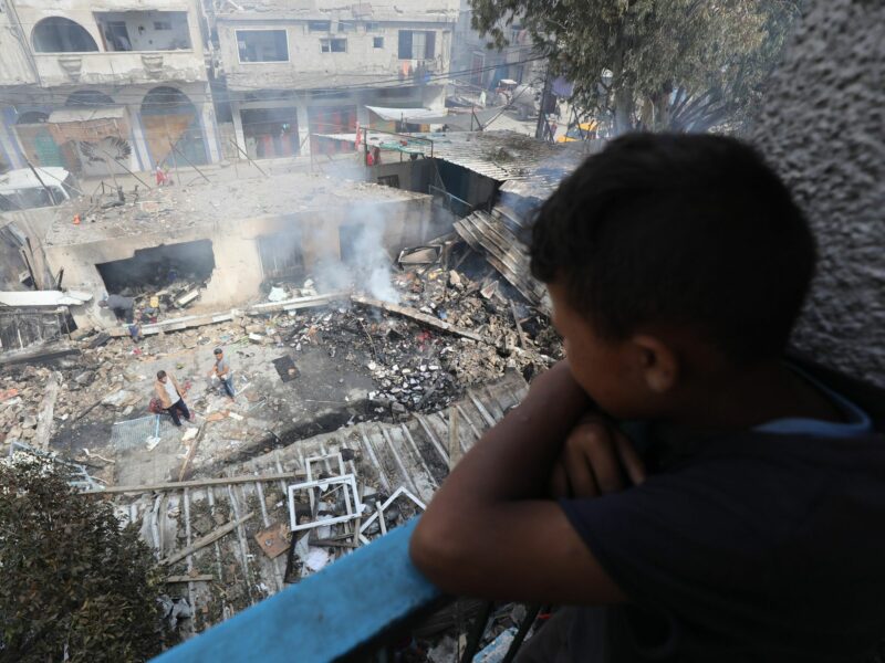 Palestinians inspect the site of an Israeli strike on a school sheltering displaced people, amid the ongoing Israel war on Gaza.