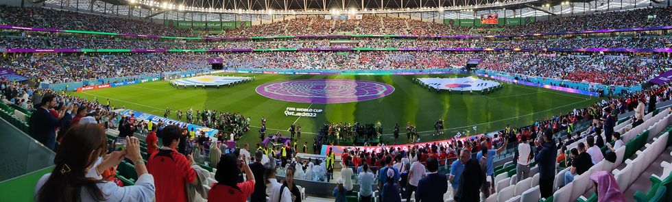 Panoramic photo of spectators inside a soccer stadium in Qatar during the 2022 FIFA World Cup