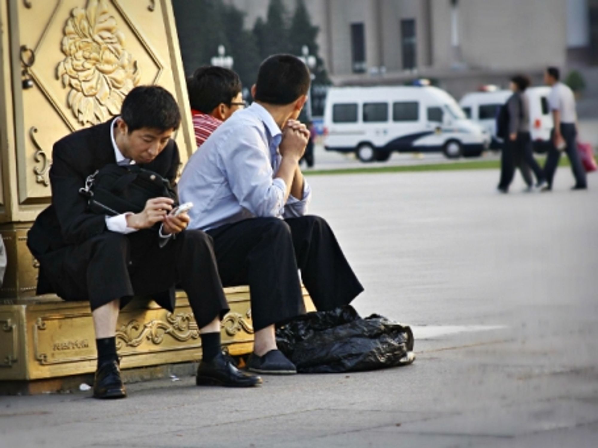 Passing time in Beijing's Tiananmen Square