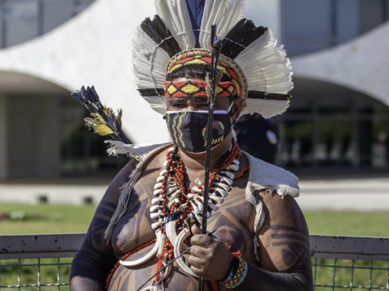Pataxos Indian protesting a bill by Brazil's government to defend the demarcation of lands.