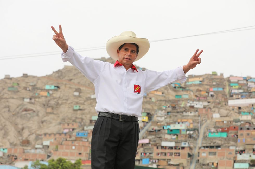 Pedro Castillo Terrones, presidential candidate for Perú Libre is posing doing the V sign during the presidential campaign