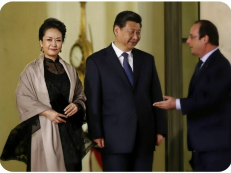 Peng Liyuan and her husband Chinese President Xi Jinping, with French President Francois Hollande
