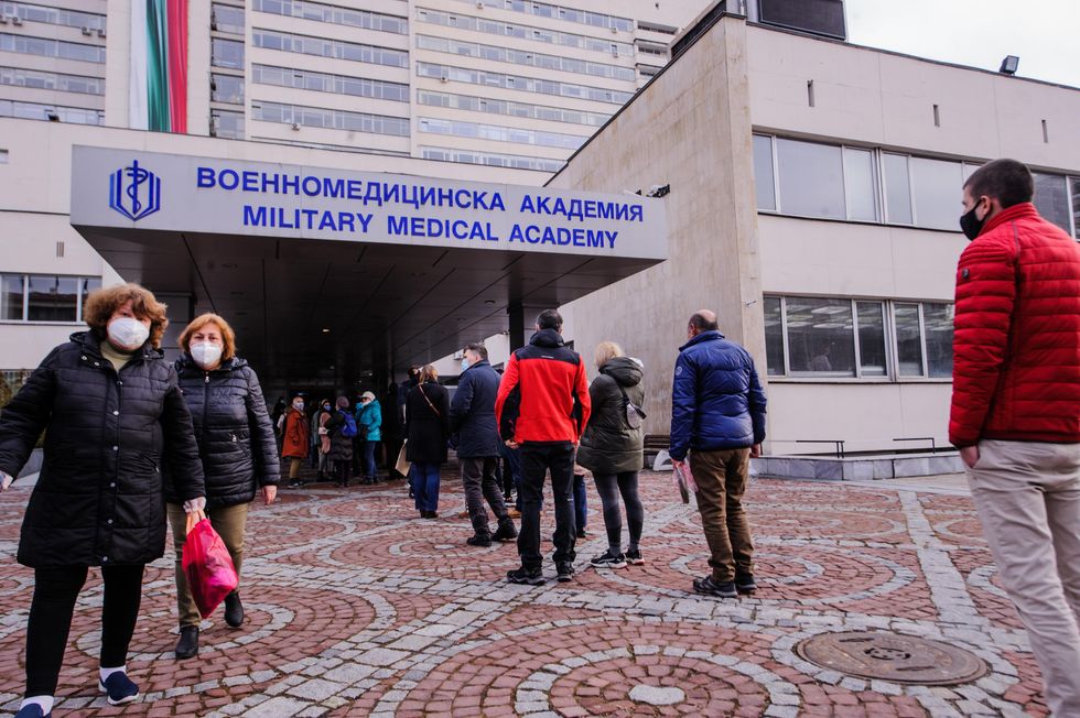 People are queueing in front of the hospital of the Military Medical Academy in Sofia, Bulgaria, to get the coronavirus vaccine