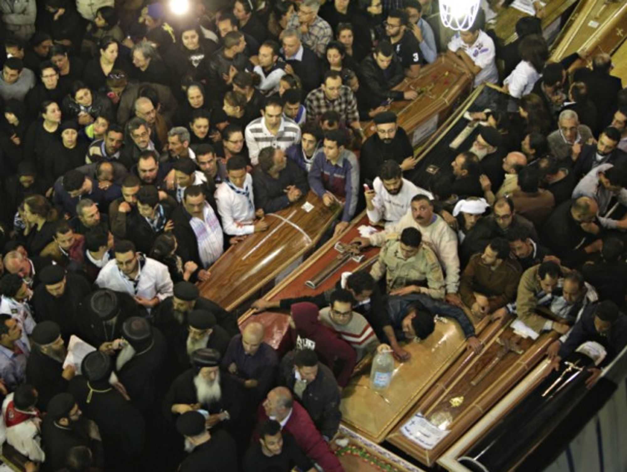 People attend the funeral of victims of the blast in Alexandria, Egypt on Sunday.