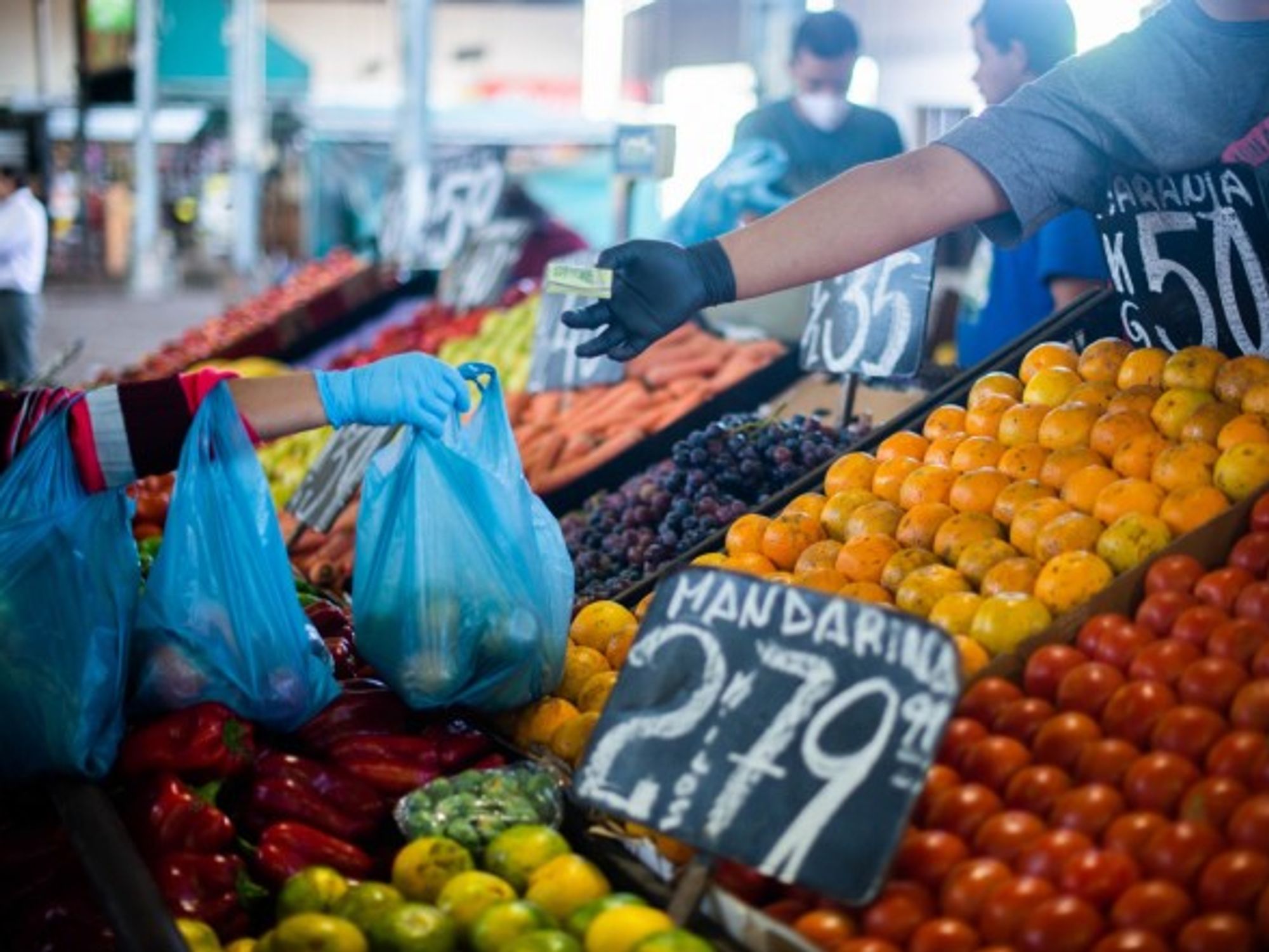 People buy food at the central market in Buenos Aires, Argentina.
