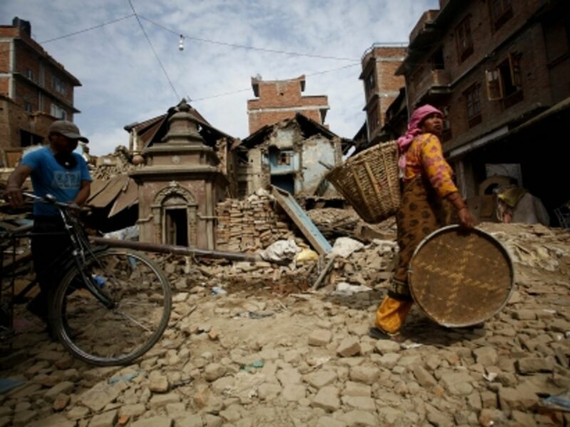 People carrying their belongings in Lalitpur, near Kathmandu, on May 16