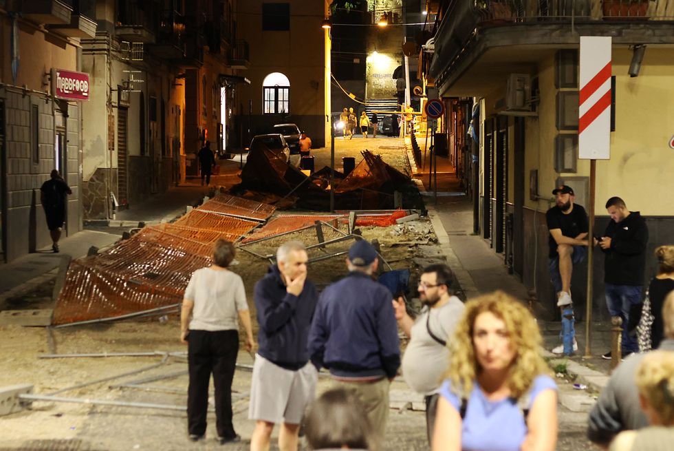 People gather in the street after an earthquake on May 20, in the city of Pozzuoli.