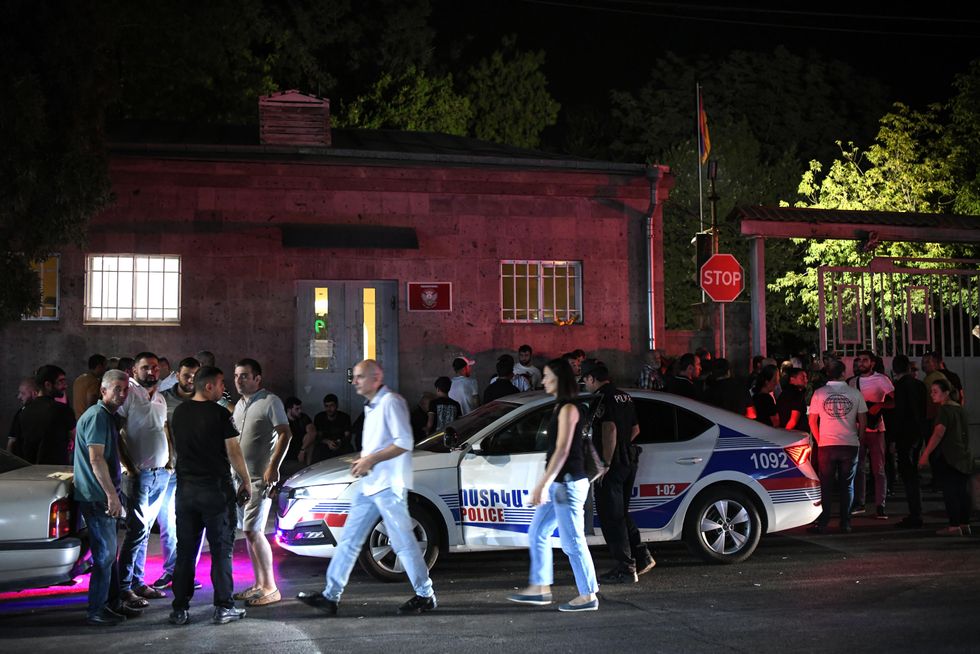People gather outside a military hospital where injured people are treated after armed clashes in Nagorno-Karabakh.