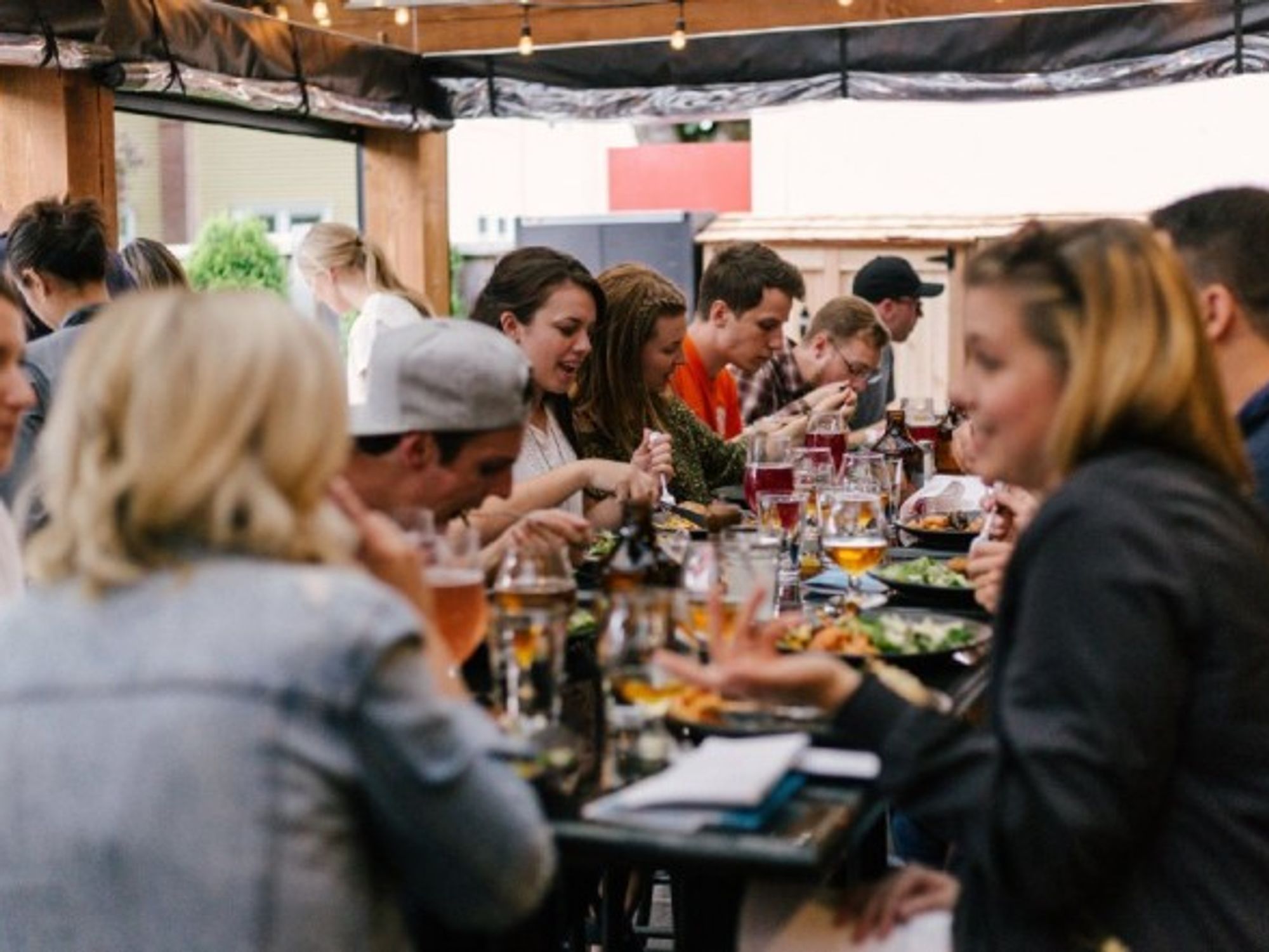 People having a meal around a table.