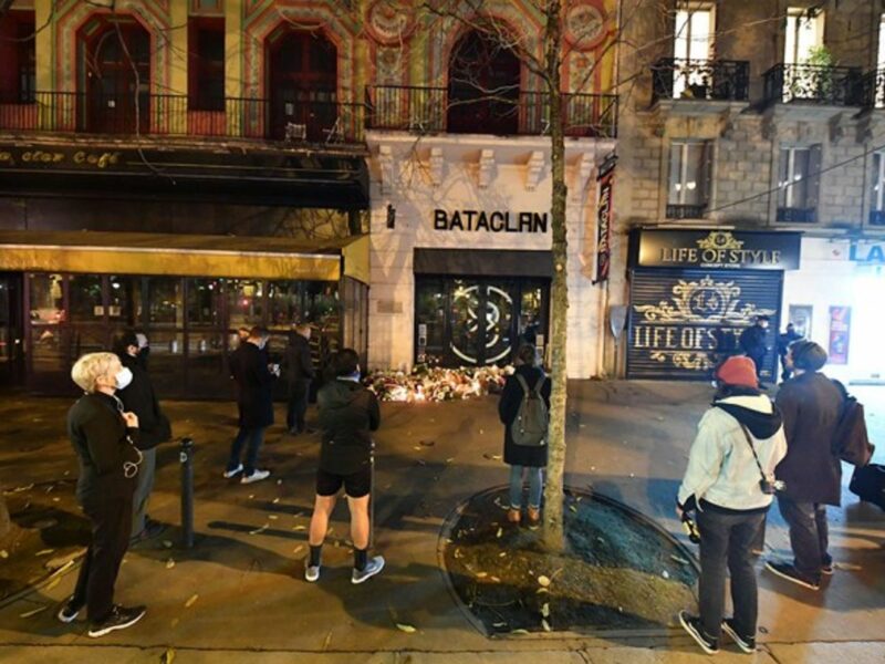 People paying tribute to victims in front of the Bataclan, Paris.