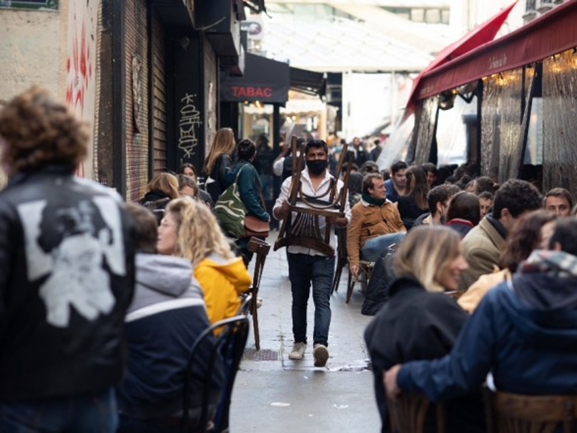 People sitting on outside terraces in Paris as restaurants and cafés reopen, May 19, 2021.