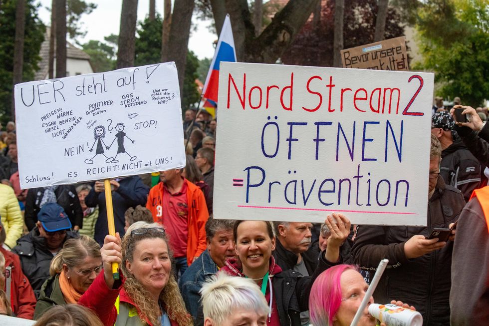 People take part in a demonstration for the commissioning of Nord Stream 2 in Lubmin